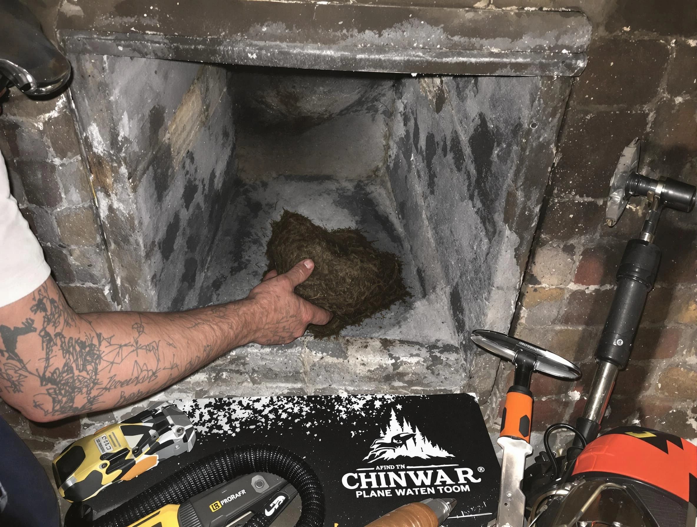 Gloucester Chimney Sweep safely removing debris and screening chimney in Gloucester, MA